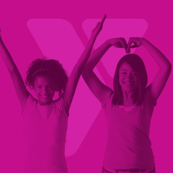 Fuscia YMCA logo on top of a color filtered image of two teenage girls