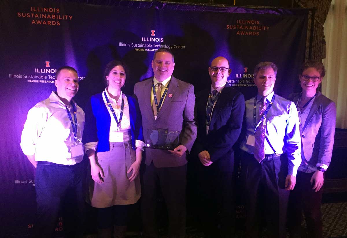 Folks from the Mightybytes team posing glamorously with the Illinois Sustainability Award.