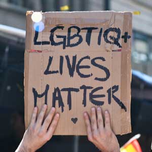 Pride protest sign that reads LGBTIQ+ Lives Matter