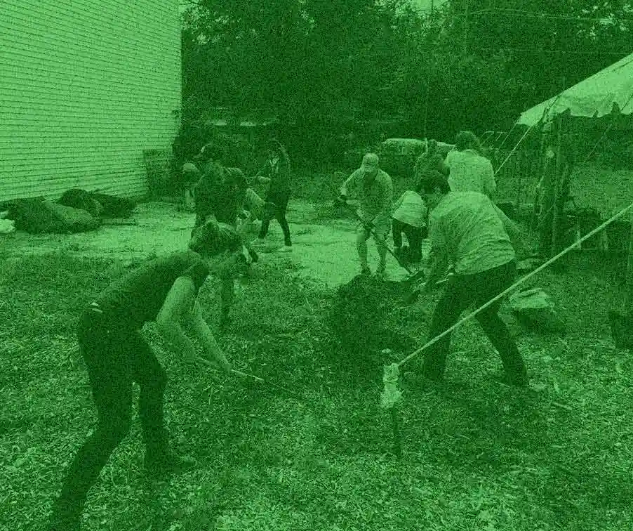 Photo of people raking and shoveling