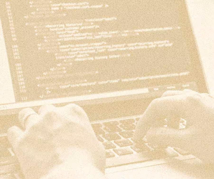 Image of hands typing on a laptop with code onscreen